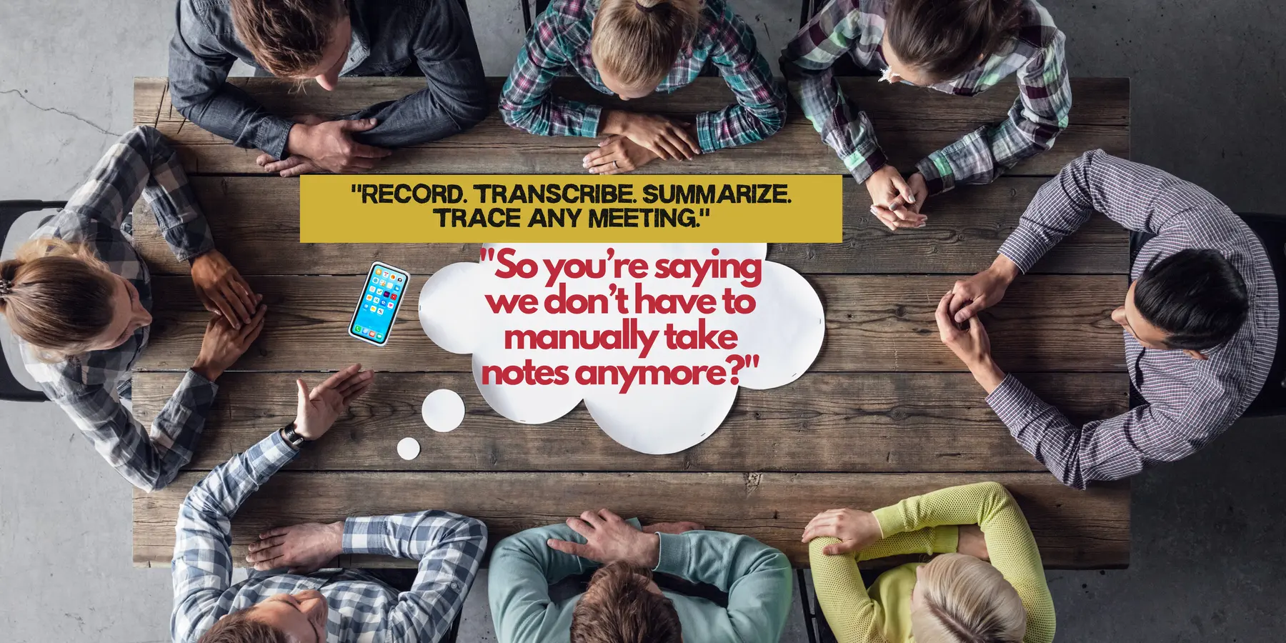 Group of people sitting around a wooden table with notebooks and coffee.